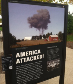 a sign reading "America Attacked!" at the flight 93 memorial