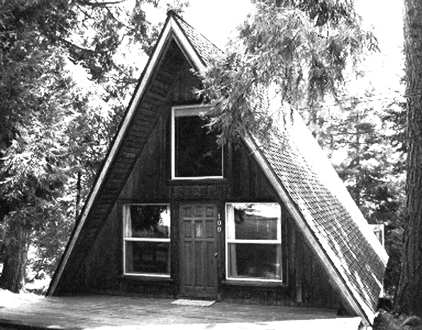 an a-frame cabin in the woods