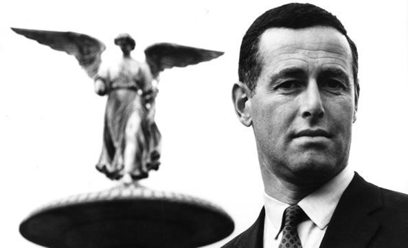 James Salter with an angel statue in the background