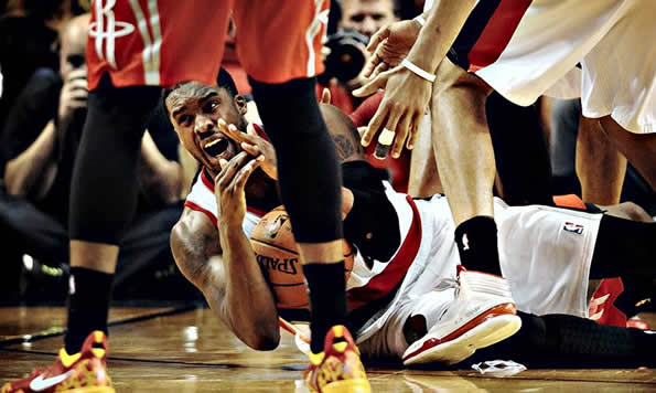 Wesley Matthews of the Portland Trail Blazers wrestles a loose ball away from Dwight Howard of the Houston Rockets