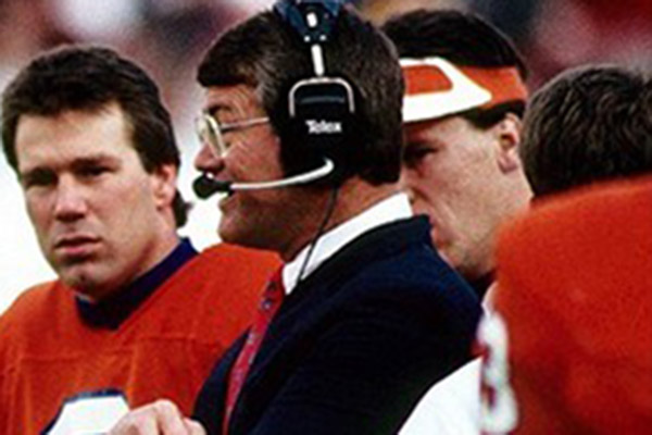 detail from photo of Gary Kubiak, Dan Reeves and Visor Man