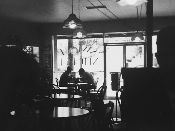 photo of two men in a coffeehouse