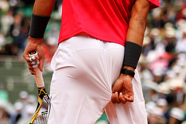 Rafael Nadal pulls his shorts from his butt
