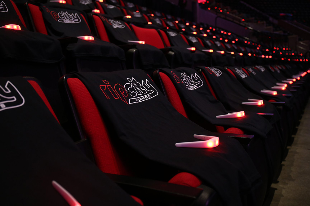 Arena seats with t-shirts on them before a Blazers playoff game