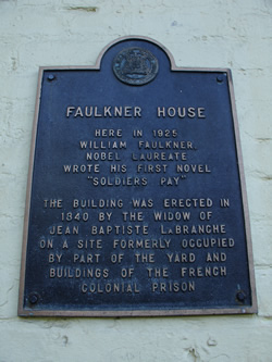 plaque outside of Faulkner House Books