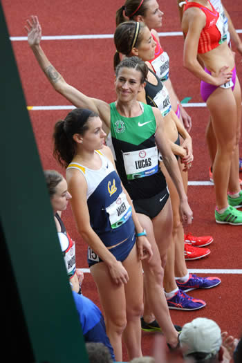 Julia Lucas waves to the crowd before running a 5000 meter race